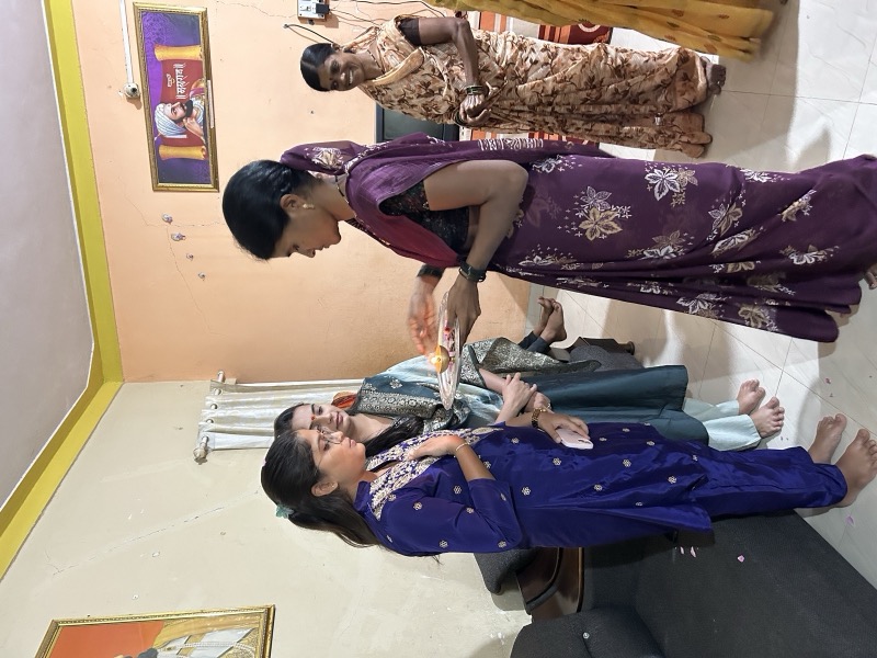 Siddhali Anup Shah in conversation with women during an indoor visit