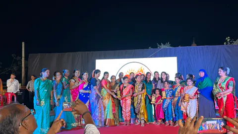 Women standing together on an outdoor event stage